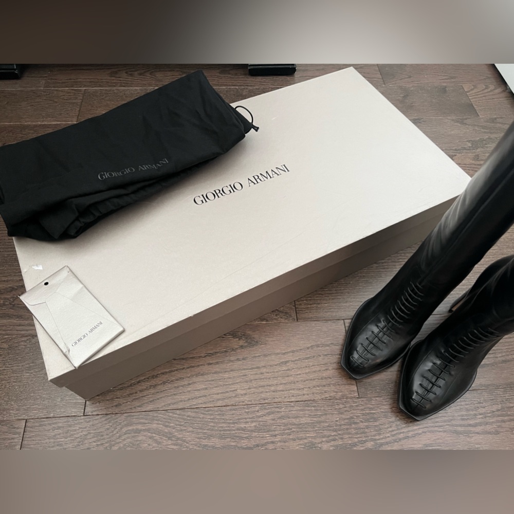 Armani boots worn only once, lace up front detail and Armani signature on back.